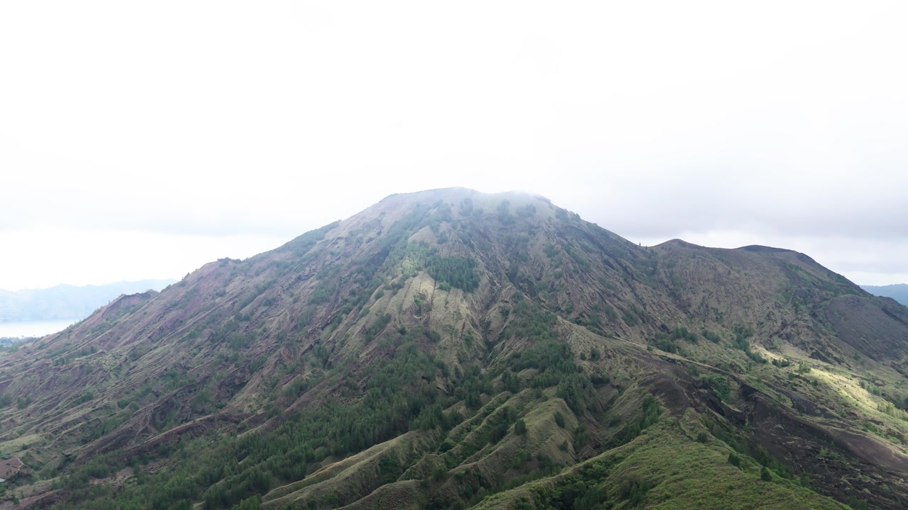 Fly towards Mount Batur, gloomy day