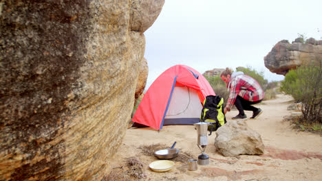 man preparing tea at camp 4k