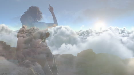 animation of blue sky and clouds over biracial couple embracing at beach