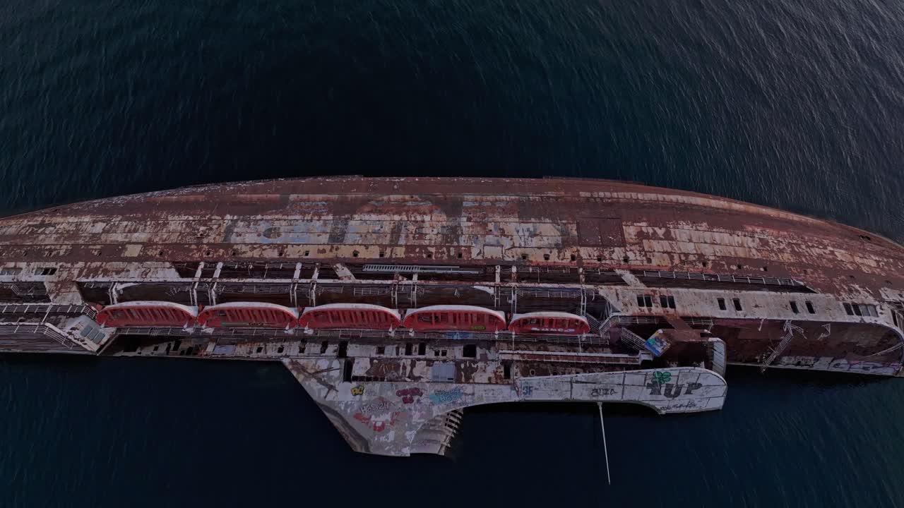 Dusk glow on abandoned ship in Elefsina Bay, Eleusis, Greece