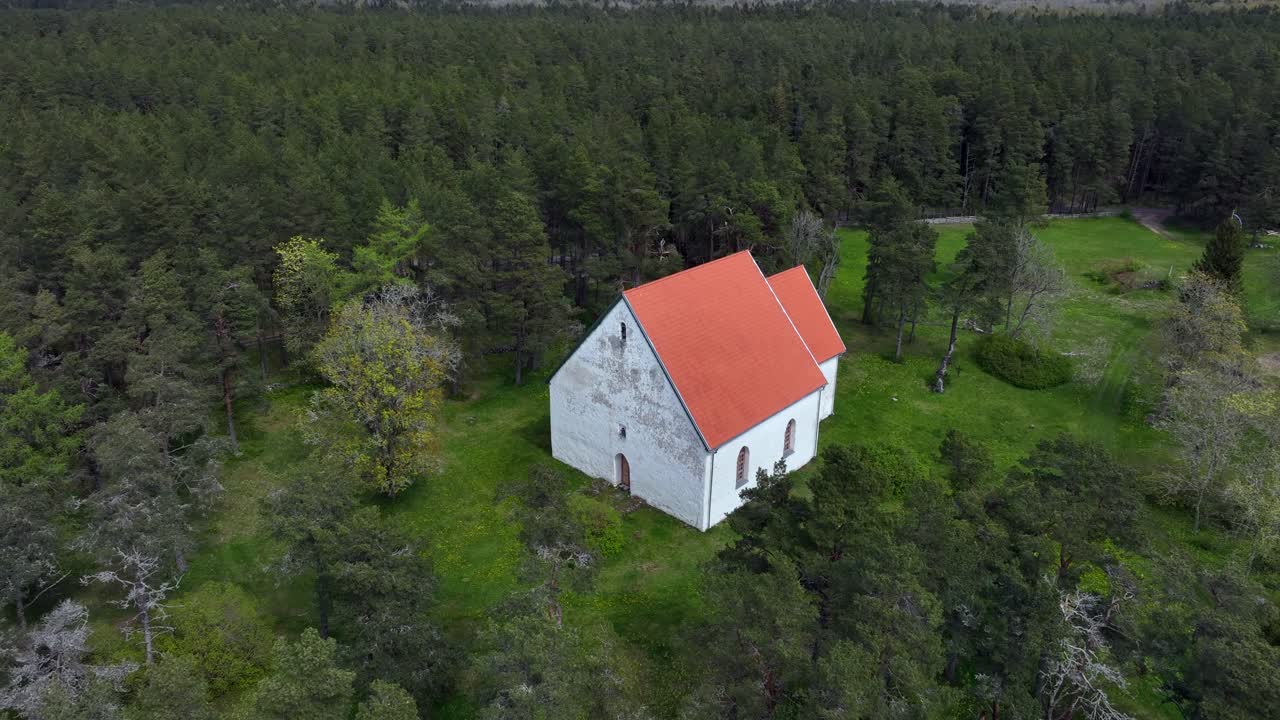 Aerial drone view of St. Olaf's Church in Vormsi, Estonia.