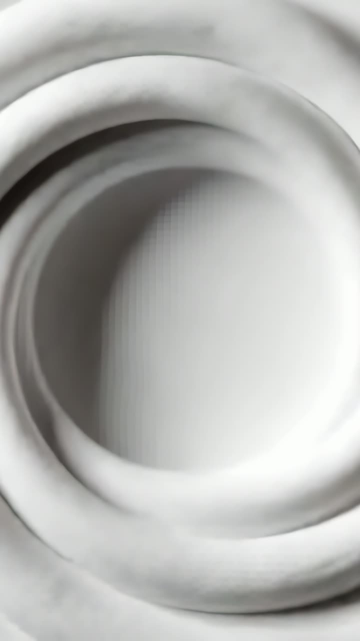 Vertical video: Rotating concentric ring form revealing inner aperture ...