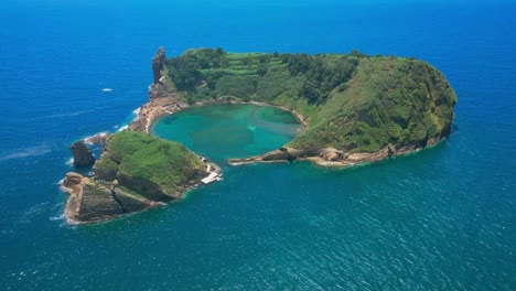 the vila franca islet in são miguel surrounded by blue ocean, aerial view