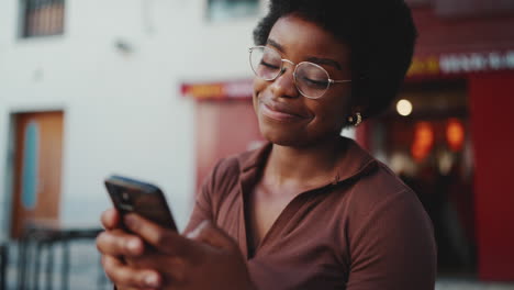 young woman using mobile phone outdoors