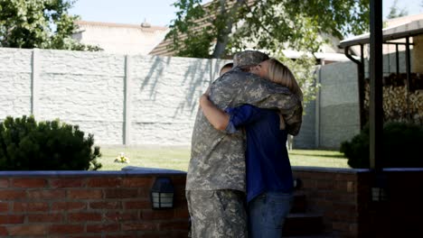 military man returning home to family