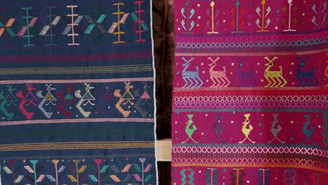 colorful guatemalan textiles for sale in a souvenir shop - close up