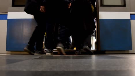 low angle, from inside metro moscow , the subway arrives and opens doors and passengers go up and down from the metro