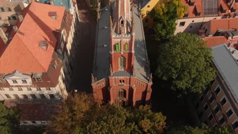 Bird's-aerial-view-of-St-Saviours-Anglican-Church-in-Riga,-Latvia,-circle-shot