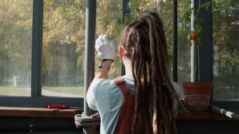 female gardener working indoors