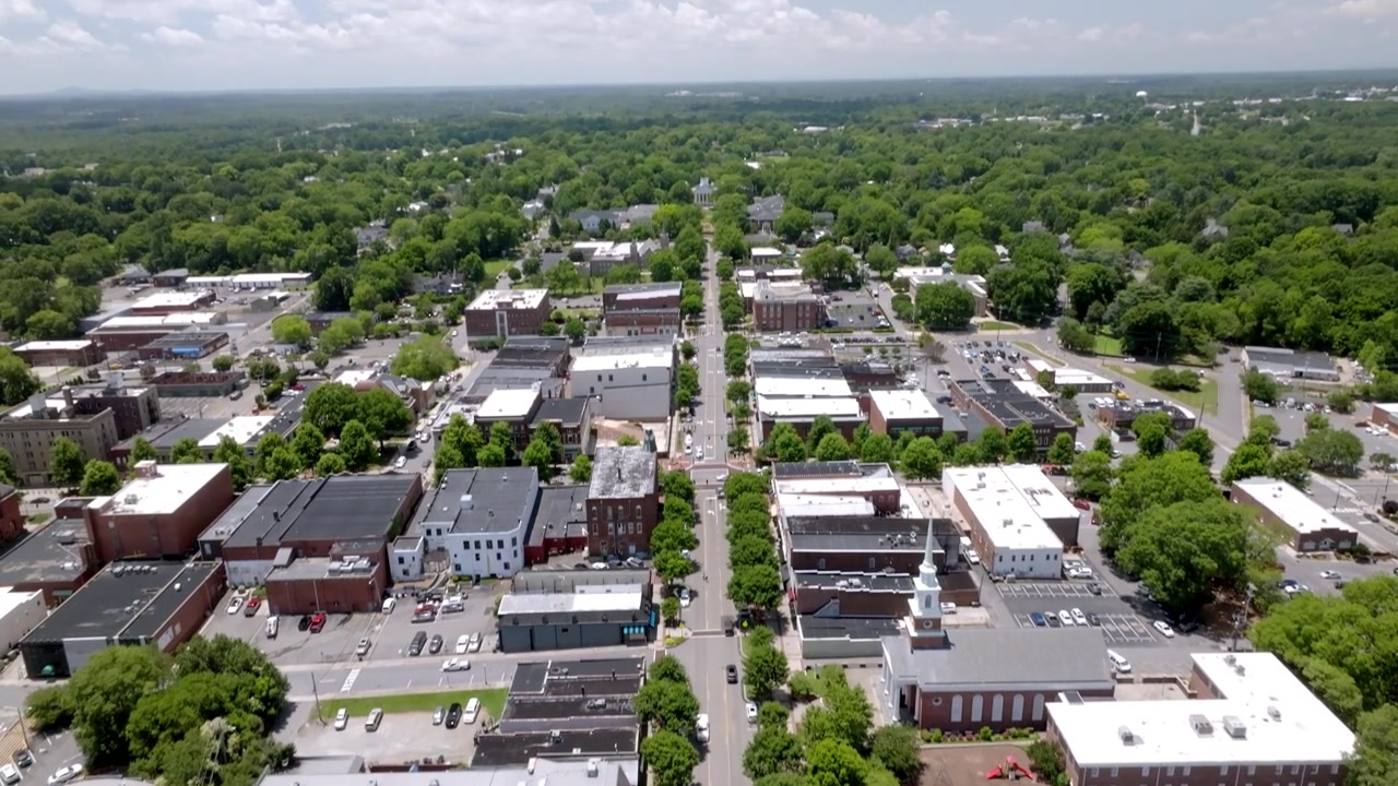 Downtown Statesville, North Carolina with drone video tilting up.