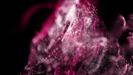 animación de puntos rosados que forman ondas dinámicas contra un fondo negro.