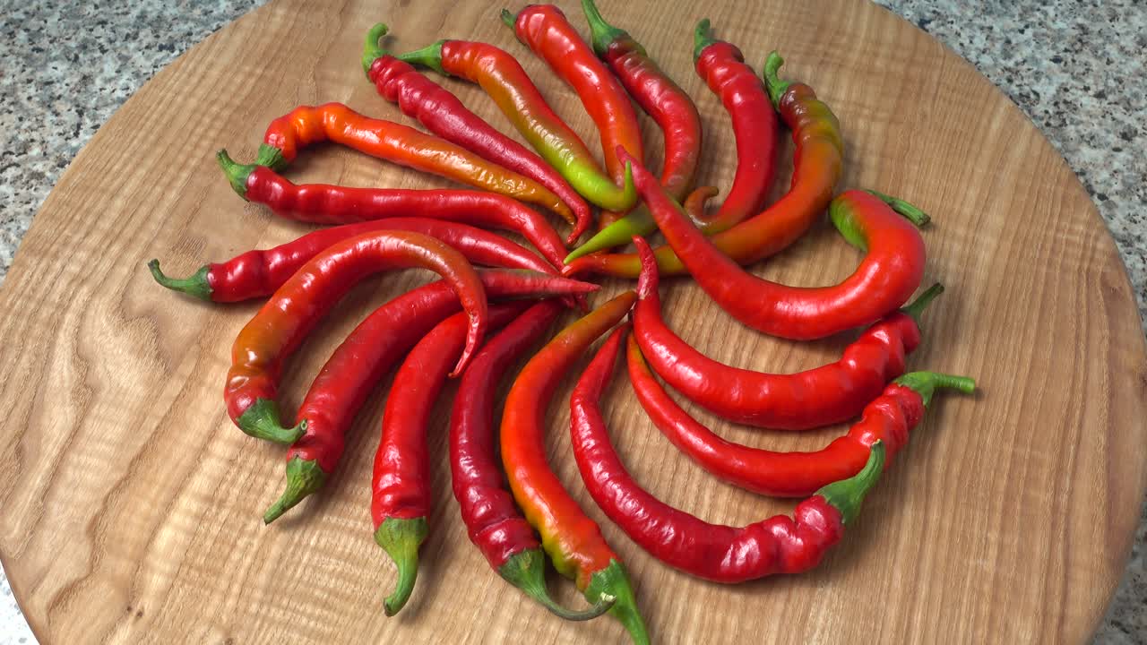 Red chilli, pepper. Shooting in the movement. Shooting in kitchen