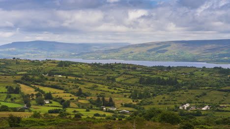 time lapse of rural landscape with hills and lake in the distance on a sunny cloudy day in arigna mountains in county leitrim in ireland