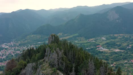 Beautiful-drone-shot-over-the-Rhodope-mountains-and-"The-bride"-rocks,-with-view-towards-the-small-town-of-Smolyan