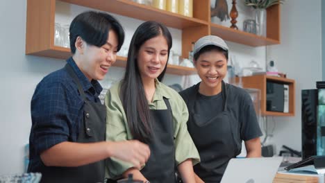 group of lgbtq young barista owner excited celebration success sign working. small businesses starting. small business owner success concept.