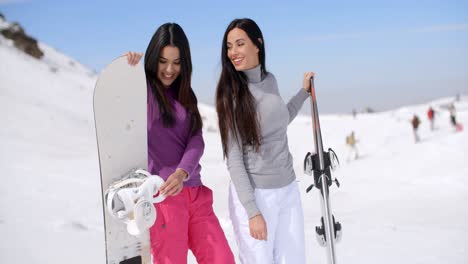 Two-attractive-female-friends-at-a-ski-resort