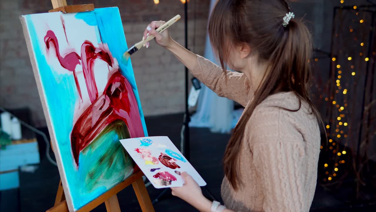 Woman Painting Flamingos on Canvas