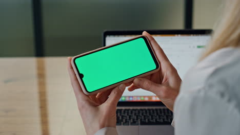 businesswoman arms holding mockup display indoors. unknown ceo watching phone