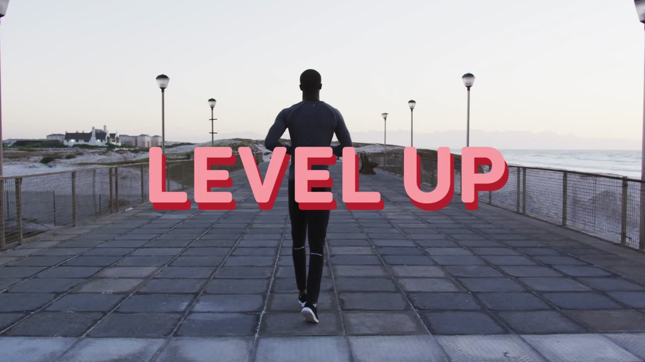 Man jogging coast while pink LEVEL UP graphic appearing causing 3D title over runner aiding fitness