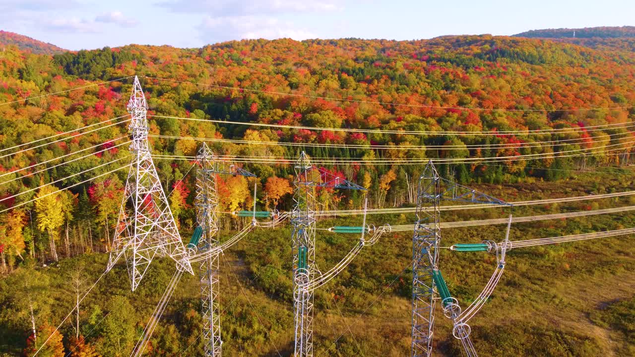 large power transmission utility lines in a colorful fall setting