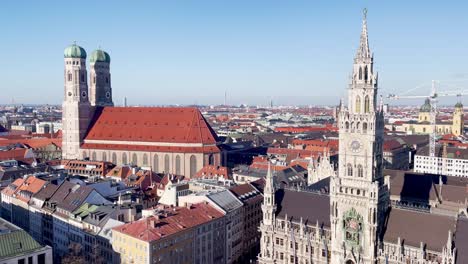 munich cityscape view with neues rathaus and frauenkirche on sunny day in germany