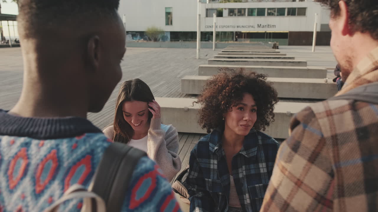 Group of friends laughing together outdoors