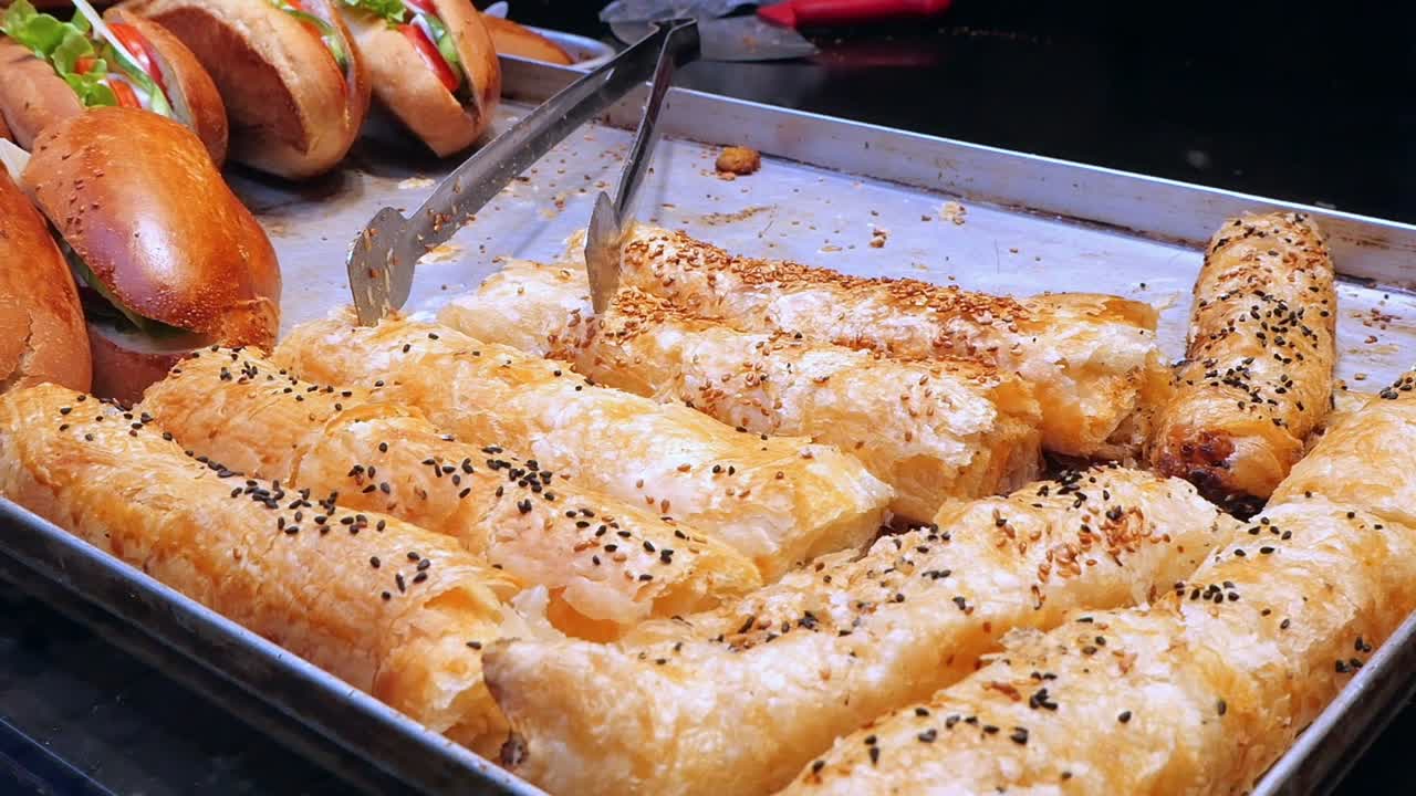 Close-up of Delicious Golden Pastries with Sesame Seeds
