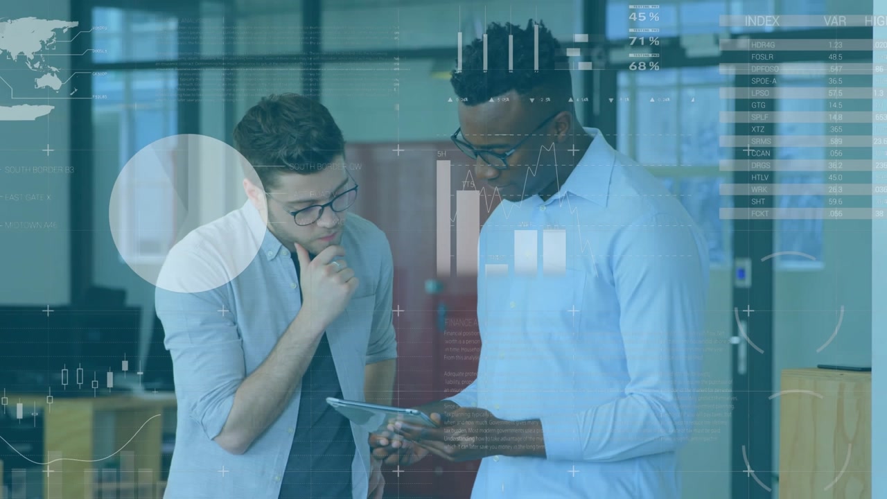 A group of young business professionals are working on a digital tablet in a modern office