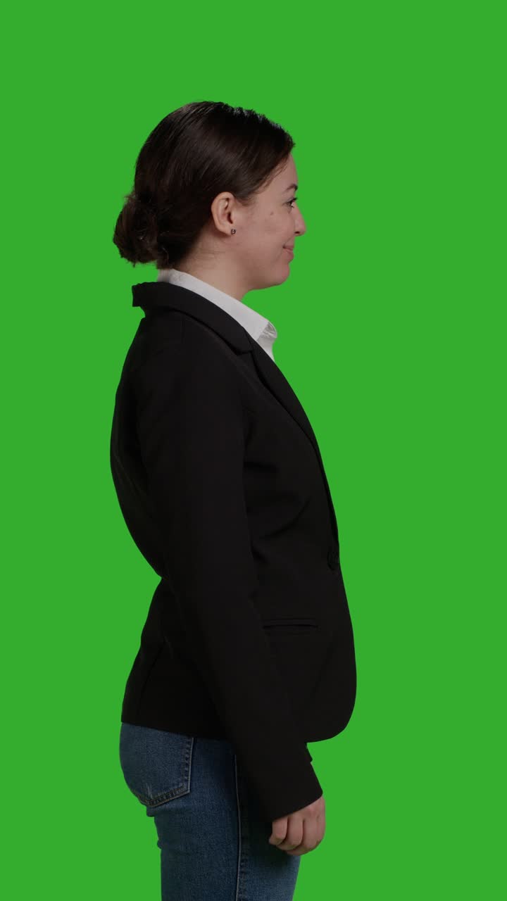 Vertical video: Profile close up of female manager wearing office suit