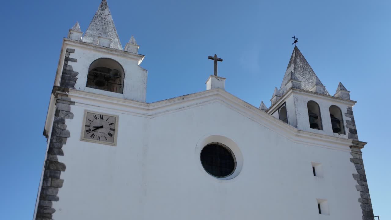 Historic church in Vila Nova da Baronia Portugal with clock tower and stone details
