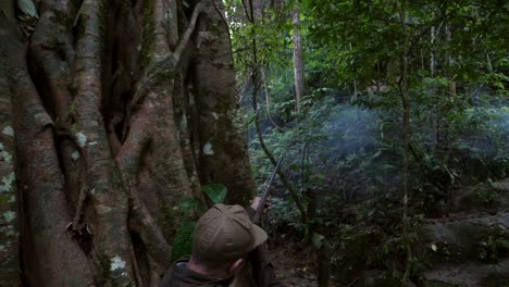 senior hunter target with laser sight in forest