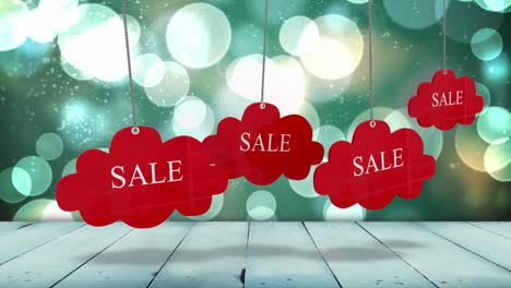 Red-sale-tags-hanging-against-glowing-background