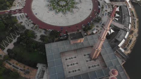 Top-down-view-of-the-Putra-mosgue-in-kuala-lumpur-during-sunset,-aerial