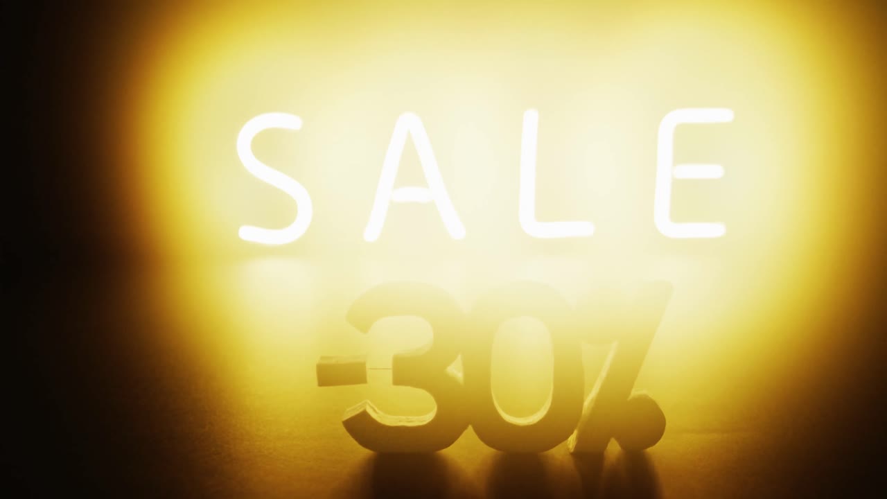 composición de texto de venta de neón en fondo negro