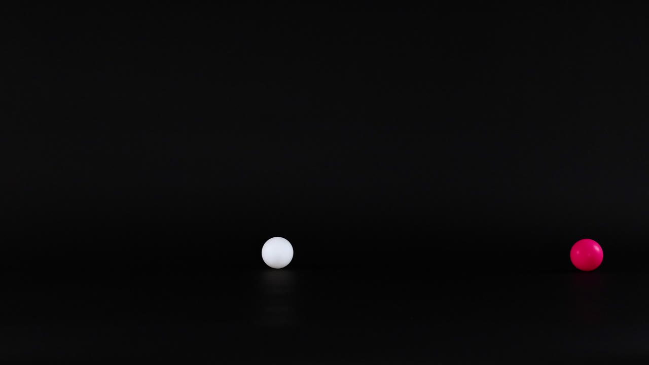 bolas vibrantes moviéndose a través de un fondo oscuro