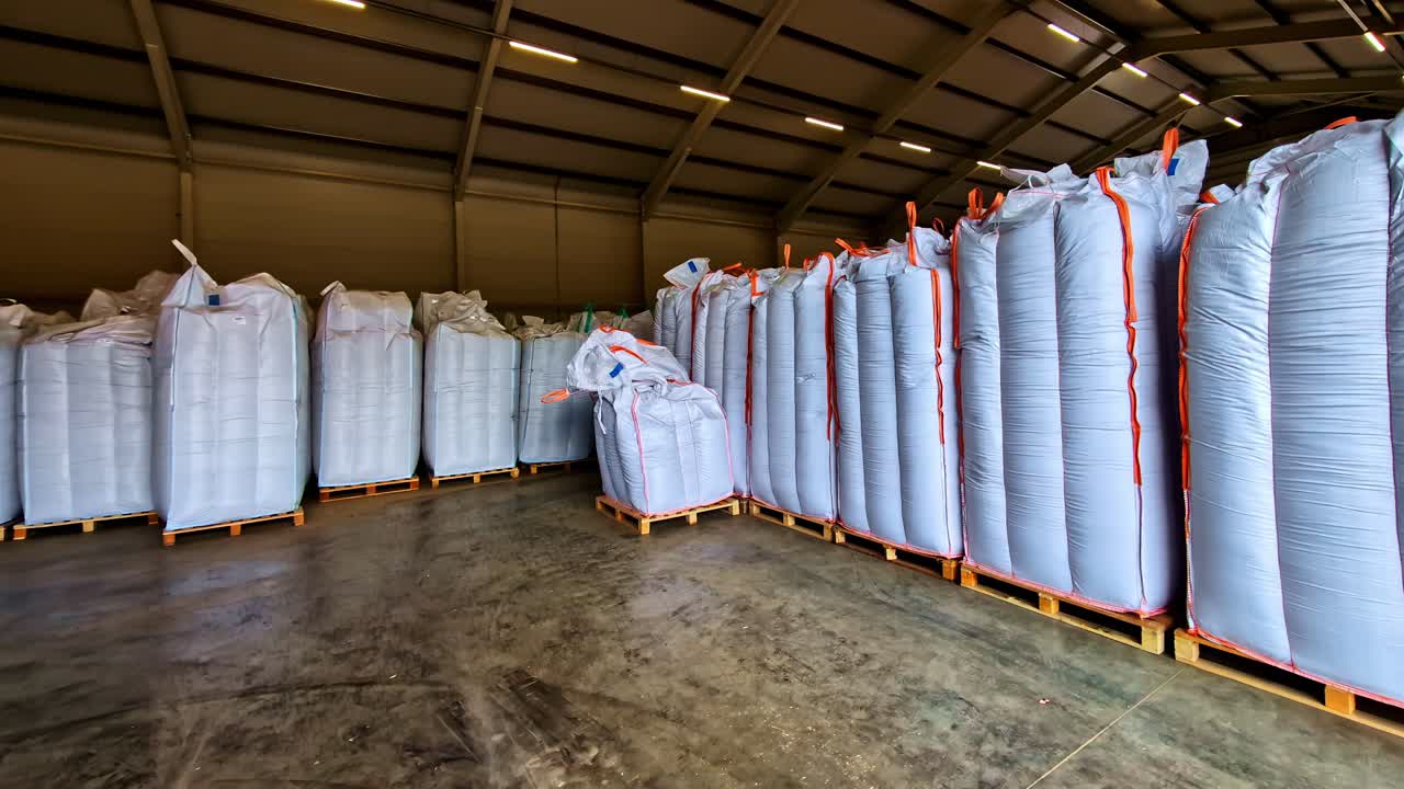 Large grain bags in a spacious warehouse in Dobele, Latvia