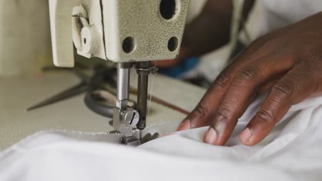 african man sewing tissue