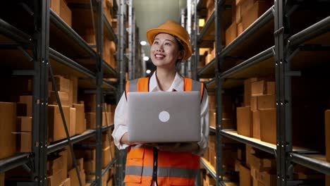 warehouse worker using a laptop