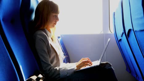 Woman-using-laptop-while-travelling-in-ferry-4k