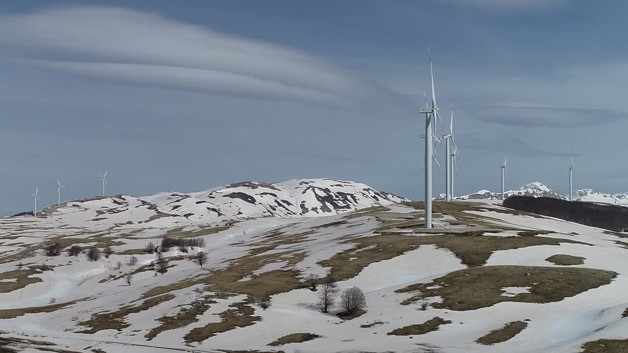 Windmill - Wind power technology - Aerial drone view on Wind Power, Turbine, Windmill, Energy Production - Green technology, a clean and renewable energy solution