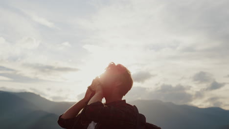 Closeup-excited-backpacker-celebrate-victory.-Traveler-reach-mountains-peak.