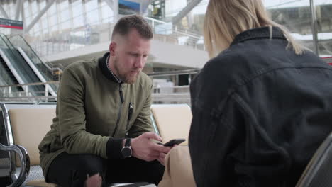 couple waiting at airport