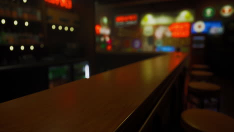warm ambiance of a cozy bar featuring retro signage at night