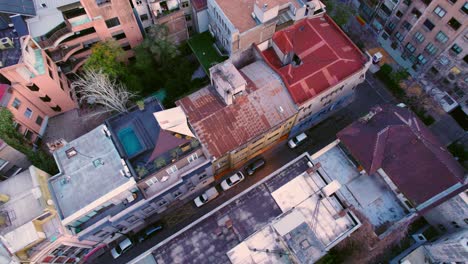 dolly in establishing aerial view of residential buildings in the early morning hours lonely streets of the bohemian neighborhood of lastarria