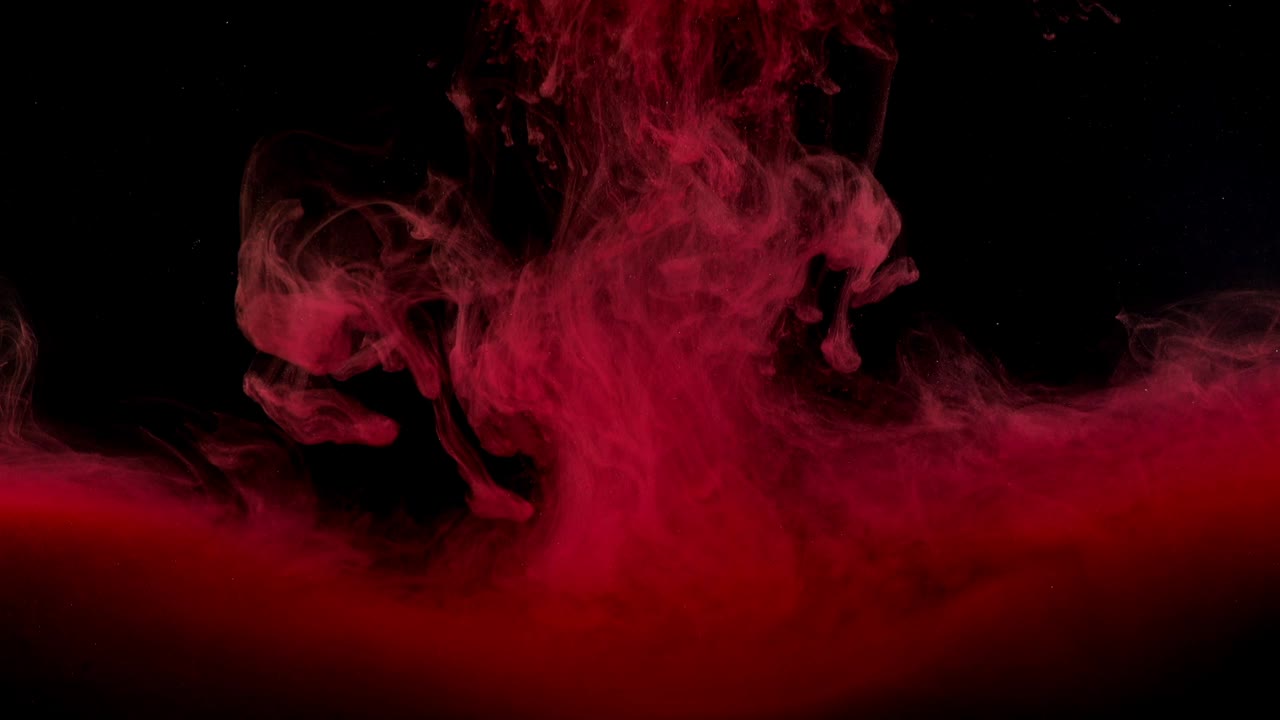 Abstract forms. Shooting on a black background. Mixing of paints