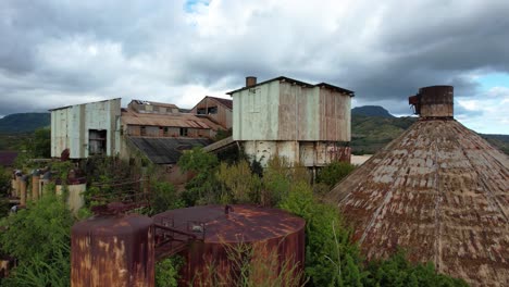 koloa sugar mill abandoned factory in kauai hawaii, aerial tilt