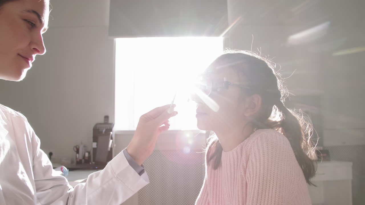 Little Girl In Trial Frame Testing Eye Vision