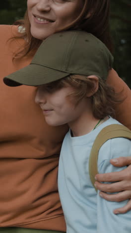 a boy and his mother in a park