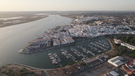 aerial panorama view over ayamonte town riverside and marina, huelva - spain