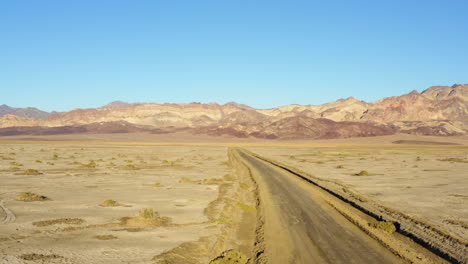 birds eye view of road amidst hot dry barren terrain of death valley national park